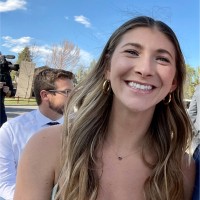 Woman with gold earrings smiling